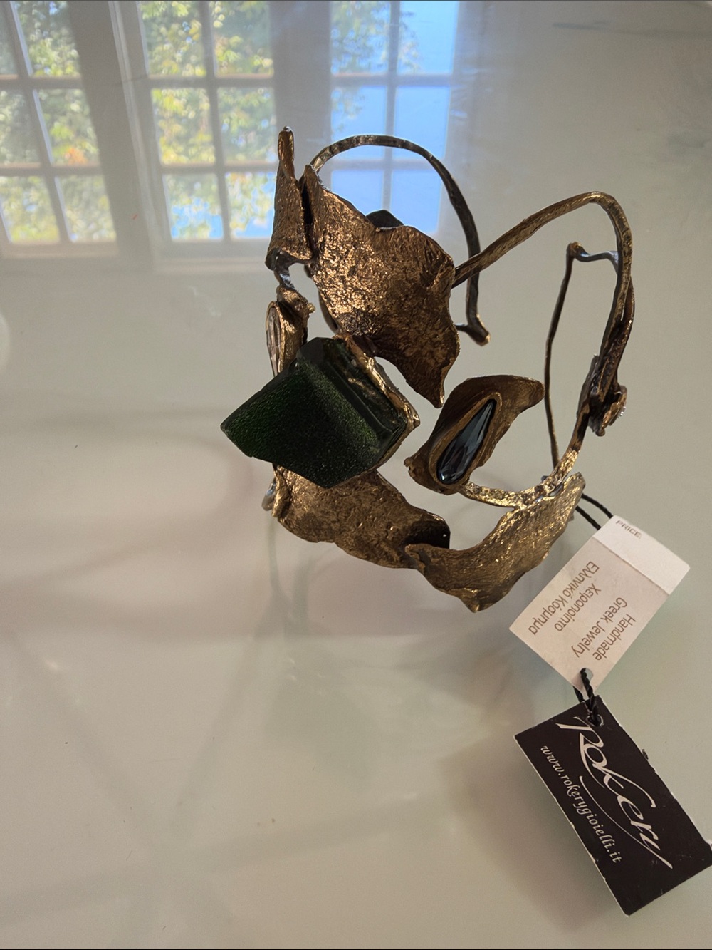 Artisan Gold-Tone Sculptural Cuff Bracelet with Green Accent